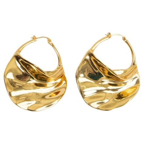 celine swirl hoop earrings|Swirl large hoops in brass with gold finishing .